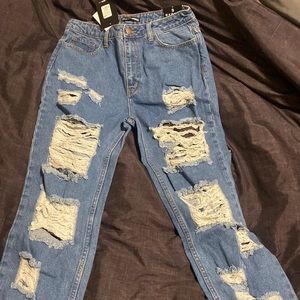 Size 9 Dark blue jeans with distress and rips